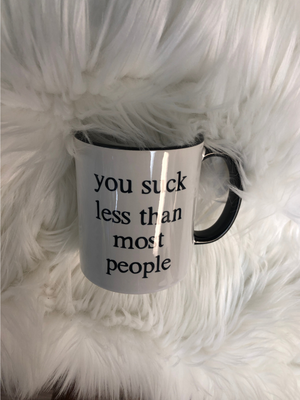 You Suck Less Than Most mug