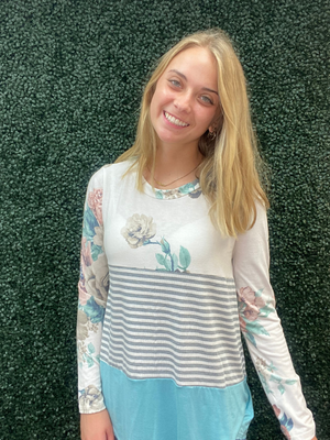 Long sleeve top accented in aqua, stripes and floral