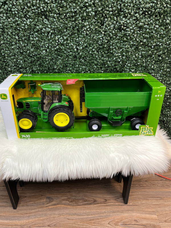 John Deere 7430 tractor with gravity wagon