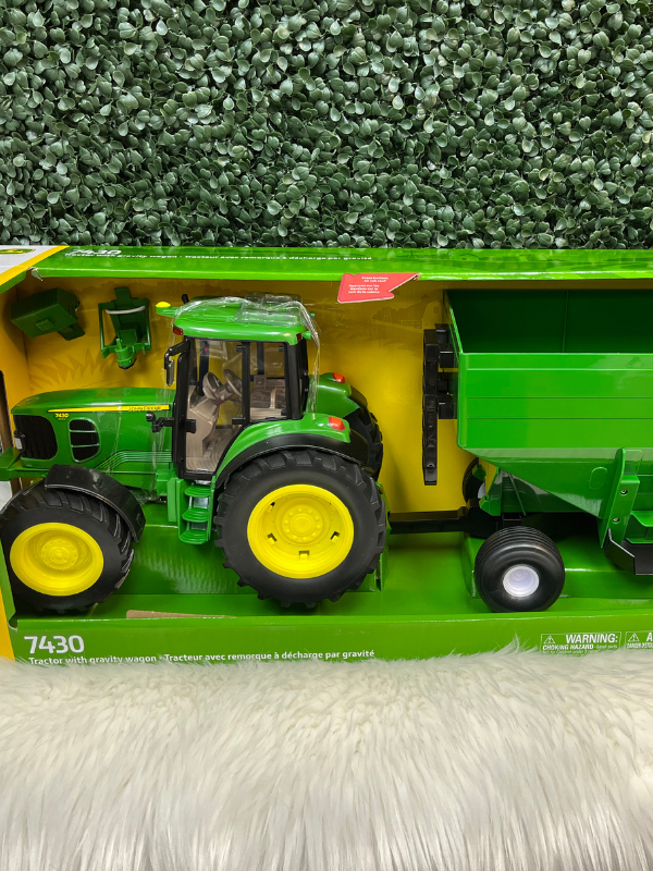 John Deere 7430 tractor with gravity wagon