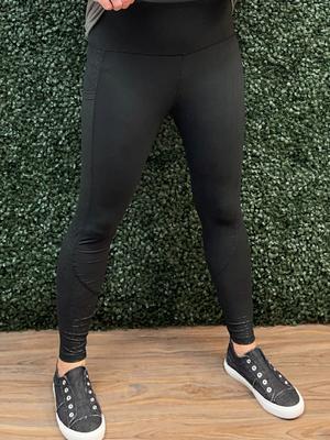 Solid black leggings with design